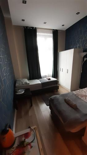 Cama o camas de una habitación en Central Sopot