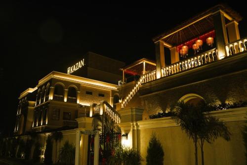 a building with lights on top of it at night at Kazan in Amritsar