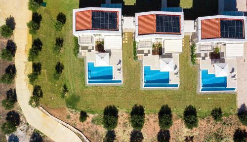 an overhead view of a house with solar panels at Nikiti Dream Villas in Nikiti