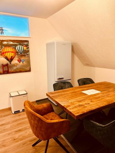 a conference room with a wooden table and chairs at Swiss Apartments Rust in Rust