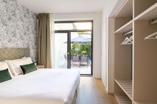 Ένα ή περισσότερα κρεβάτια σε δωμάτιο στο Aiello Hotels - CityLife Apartments