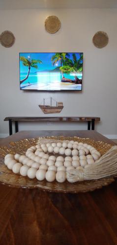 a wooden table with a picture of a boat on it at Serene Furnished Apartments in Vipingo
