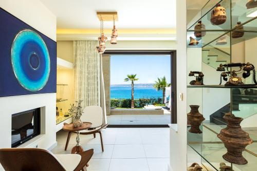 a living room with a view of the ocean at Miraida Exclusive Residence in Almirida