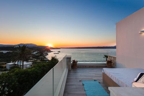 a sunset from the balcony of a house at Miraida Exclusive Residence in Almirida