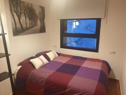 Posteľ alebo postele v izbe v ubytovaní Sierra Nevada piso radiante wifi y parking gratuito