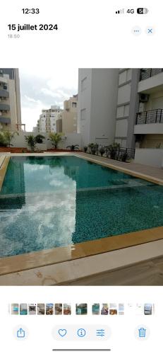 a picture of a swimming pool in a building at Lynda in Nabeul