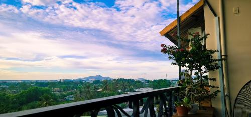 a balcony of a building with a view of a mountain at Magnolia Hotel Cam Ranh in Cam Ranh