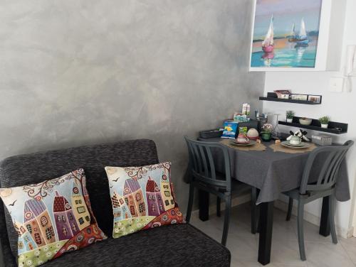 a dining room with a table and a chair at Casa Melo in Ciampino