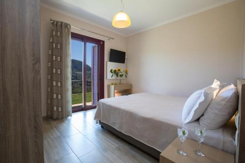 Ένα ή περισσότερα κρεβάτια σε δωμάτιο στο Αthina Villas