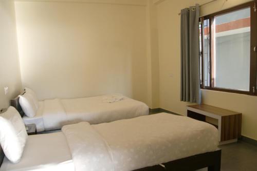 Cama o camas de una habitación en The Orchards - 果园