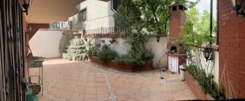 a courtyard of a building with plants and a building at fuar VİLLA in Beylikduzu