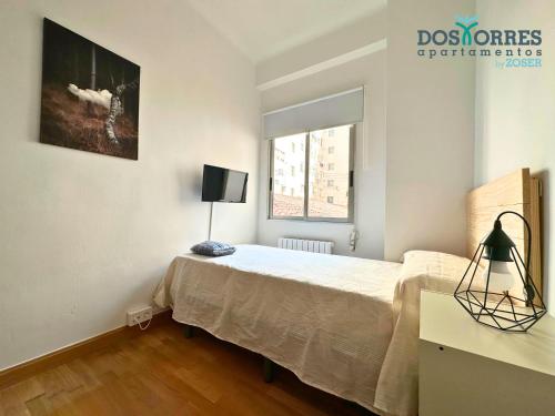 Postel nebo postele na pokoji v ubytování Dos Torres Saruman - Espacioso con 7 Camas Individuales