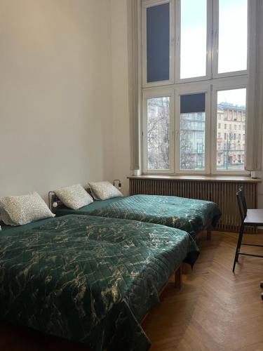 Postel nebo postele na pokoji v ubytování Tom Hostel