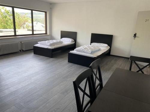 Ένα ή περισσότερα κρεβάτια σε δωμάτιο στο Ferienzimmer Nr 26