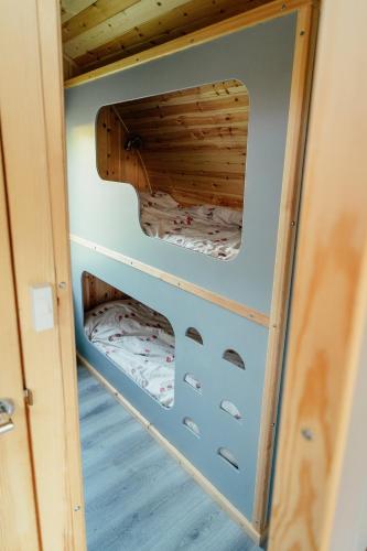 a bunk bed in a tiny house at Glamping Pods in Milngavie