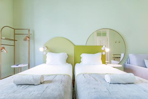 Ένα ή περισσότερα κρεβάτια σε δωμάτιο στο LR Guest House