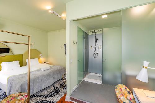 Ένα ή περισσότερα κρεβάτια σε δωμάτιο στο LR Guest House