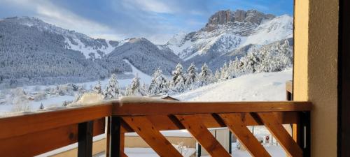 a balcony with a view of a snow covered mountain at Little Corner of Paradise in Gresse-en-Vercors