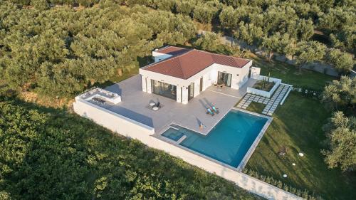 an overhead view of a house with a swimming pool at Drallos Luxury Villa - Private Heated Pool & Large Groups, by ZanteWize in Alikanas
