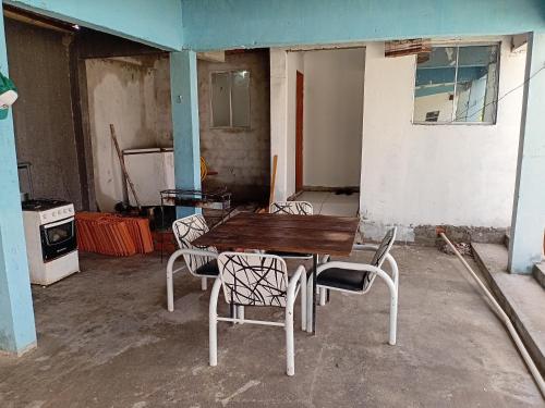 an empty room with a table and chairs in it at Pousada do Paraiba in Salinópolis