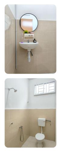 a bathroom with a sink and a toilet and a mirror at Homestay DprimaSJHome in Temerloh