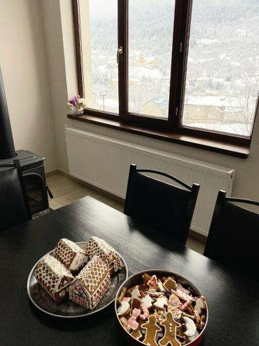 a table with a plate of food on top of it at Roza's guest house in Mestia