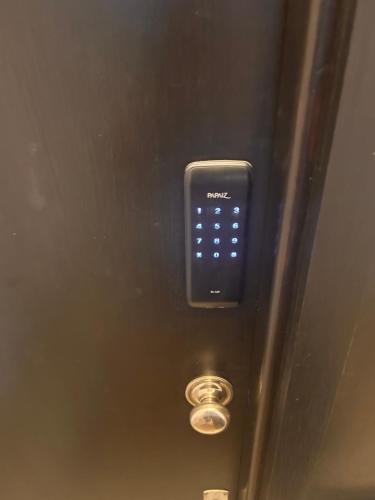 a close up of a remote control on an elevator at Rambla Apart in Montevideo