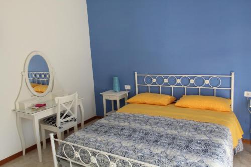 Ένα ή περισσότερα κρεβάτια σε δωμάτιο στο Cala Annachiara