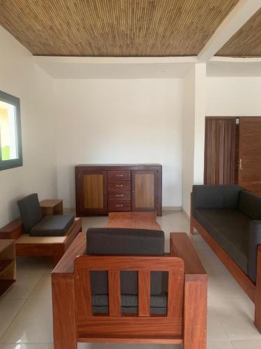 a living room with two couches and a couch at Résidence Kanissa in Cap Skirring