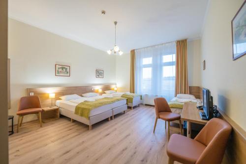 Postel nebo postele na pokoji v ubytování Baross City Hotel - Budapest