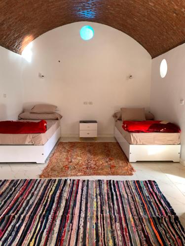 Кровать или кровати в номере Salatoos Mango Garden and Guesthouse