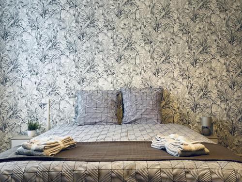 Una cama o camas en una habitación de Au Logis Briand - Appartement 3 Chambres - Bâtiment historique