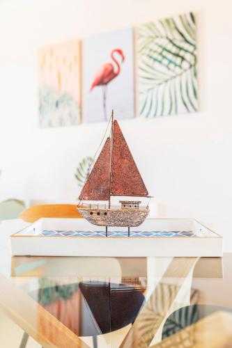 a model of a boat on a glass table at ALMA HILLS Gialova in Gialova