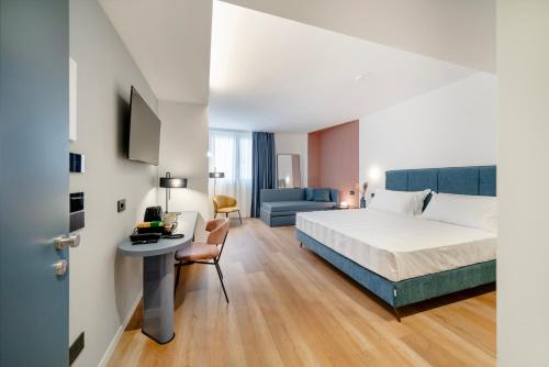 Postel nebo postele na pokoji v ubytování BISCARDI Hotel