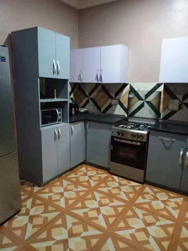 Η κουζίνα ή μικρή κουζίνα στο Grey Villa Hills