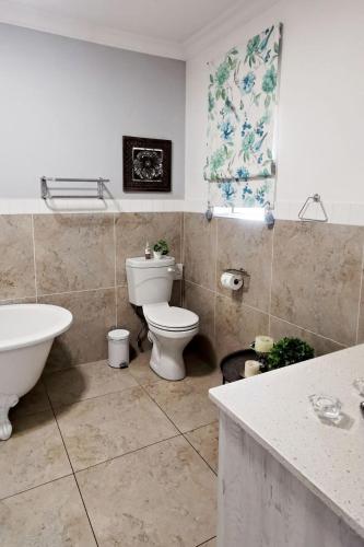 Ένα μπάνιο στο Bokmakierie Gastehuis Emalahleni Pty Ltd
