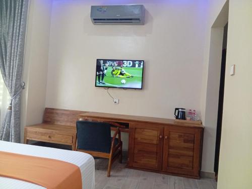 TV a/nebo společenská místnost v ubytování Hôtel Noahgarden 3