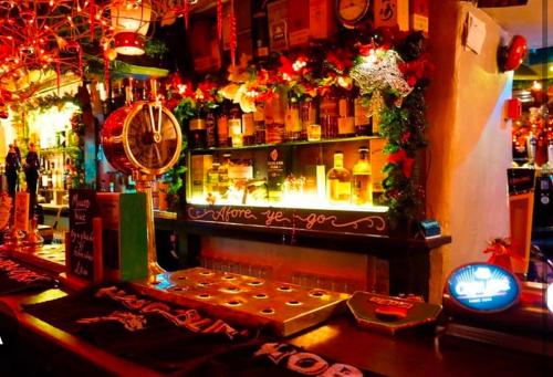 a bar with a lot of bottles of alcohol at Bryn Glasfor in Barmouth