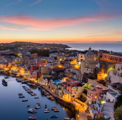 an aerial view of a city at night at Mezza Torre B&B in Procida