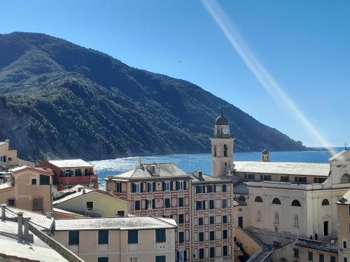 a view of a city with a mountain in the background at Sea view Camogli Portofino in Camogli