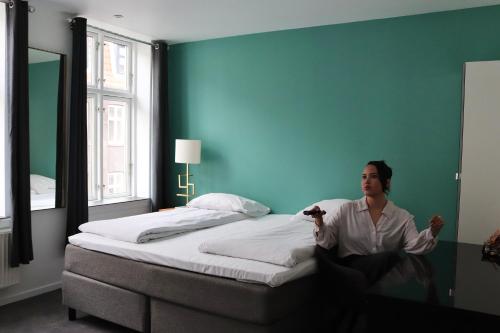 Postel nebo postele na pokoji v ubytování A Hotels City