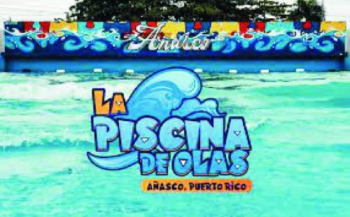 a sign for a pokemon show in the water at West Side Studio Apartments in Anasco