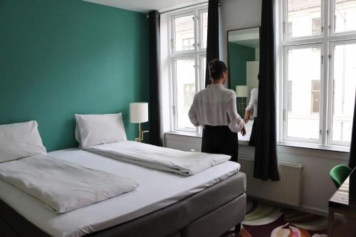 Postel nebo postele na pokoji v ubytování A Hotels City