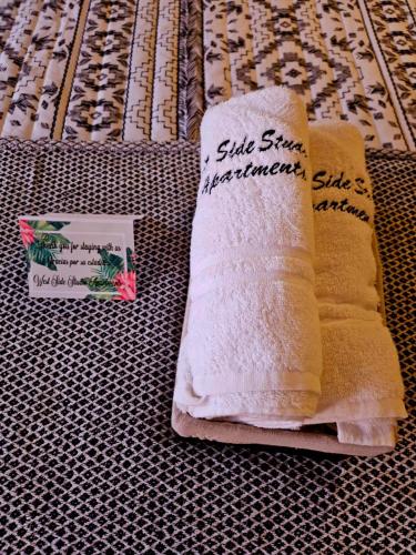 a couple of towels sitting on top of a table at West Side Studio Apartments in Anasco