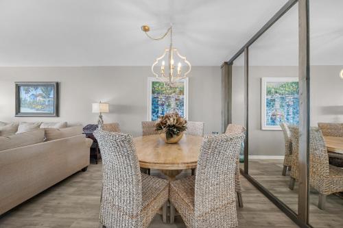 a dining room with a table and chairs at Bluewater Vacation Rentals in Orange Beach