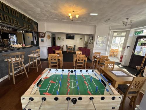 a poker table in the middle of a restaurant at Carlton Court Hotel Eastbourne in Eastbourne
