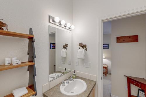 a bathroom with a sink and a mirror at Aspenglow Condo 67 in Government Camp