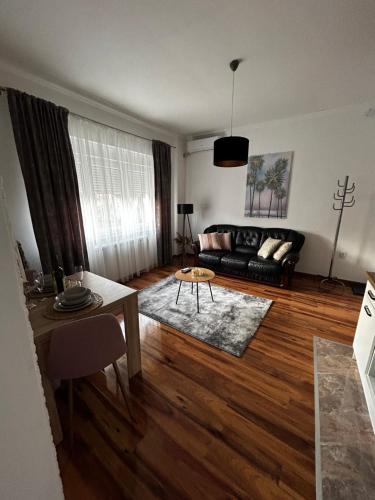a living room with a couch and a table at Alma Mons in Vrdnik