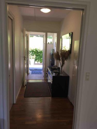 a hallway with a door leading into a room with a door at Dream house with lake view, 20 min near Copenhagen in Virum