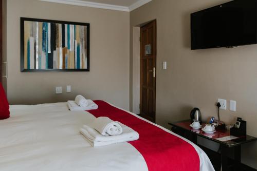 Katil atau katil-katil dalam bilik di Le Grand Chateau Hotel